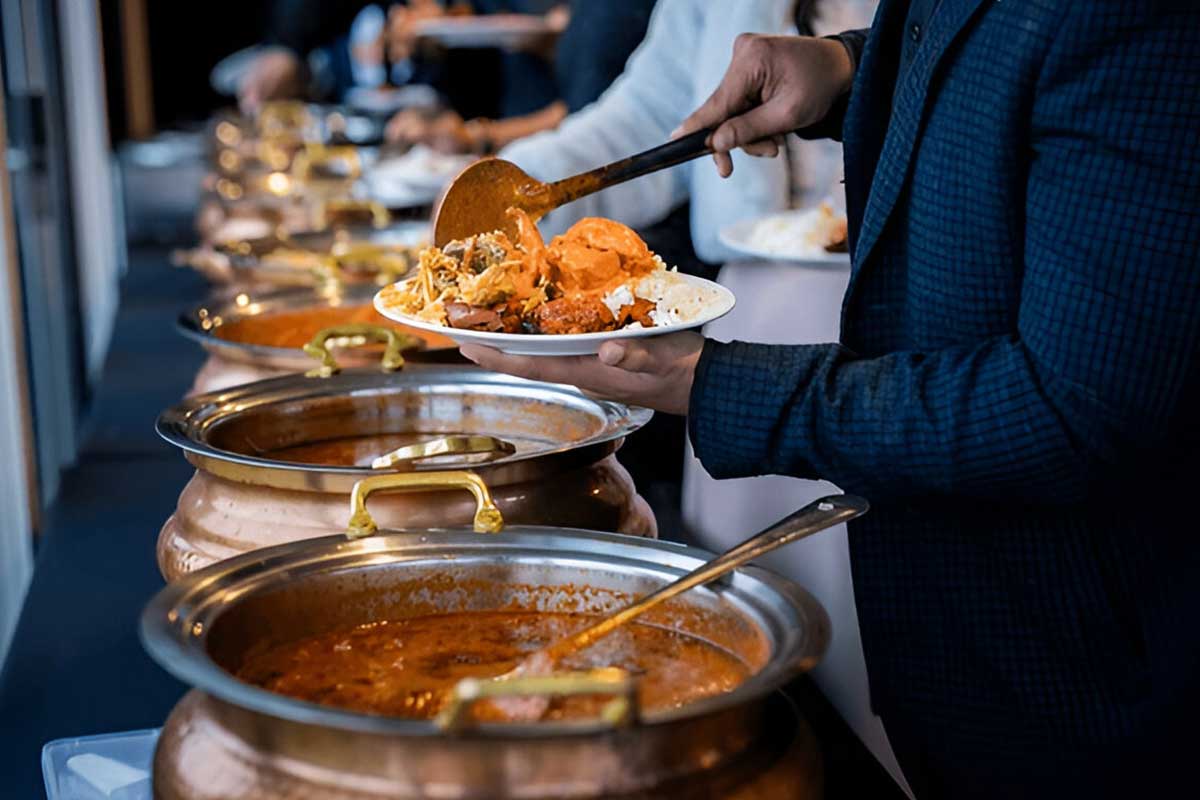 People enjoying authentic Indian catering at an event hosted by Ikkayees Indian Restaurant Liverpool-Indian catering